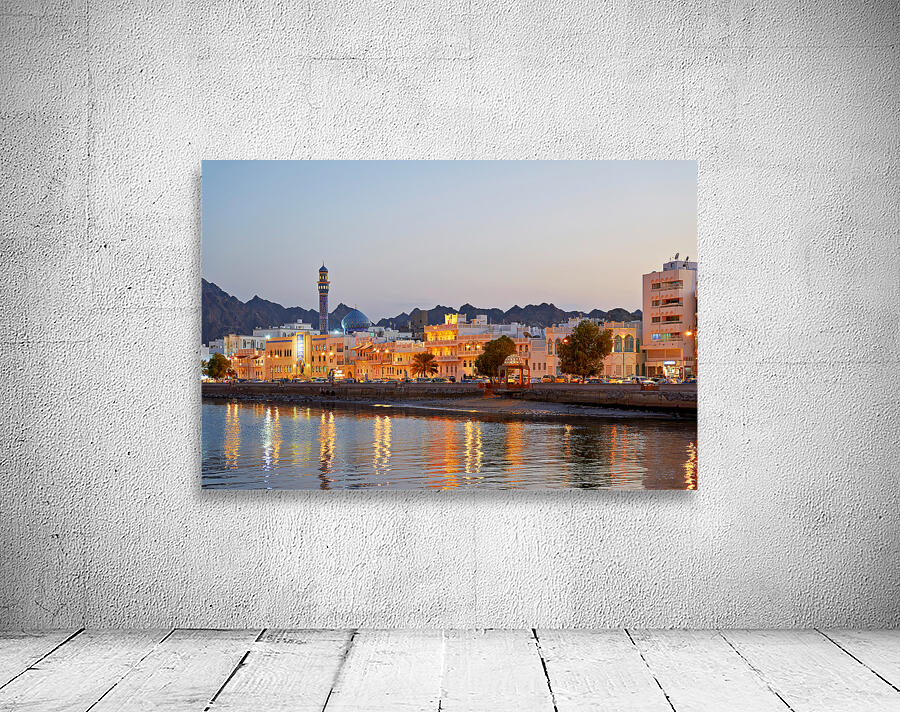 Sunset view of waterfront in Muscat Oman with city lights Wall Preview