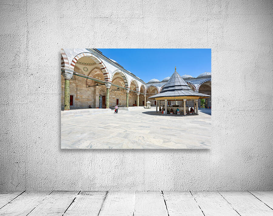 Visitors explore the courtyard at Fatih Mosque in Istanbul Wall Preview