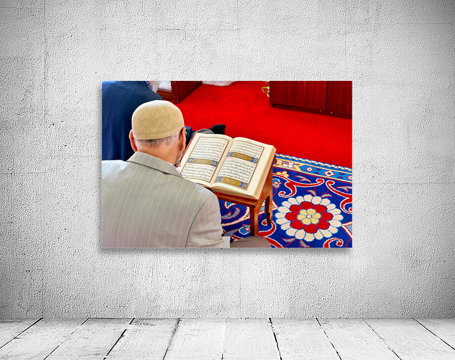 Man reading Quran inside Fatih Mosque in Istanbul Turkey Wall Preview