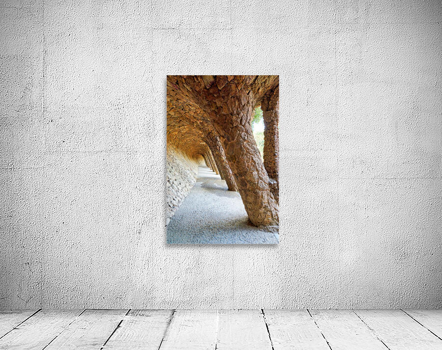 Walking through the colonnaded pathway in Park Guell Barcelona Wall Preview