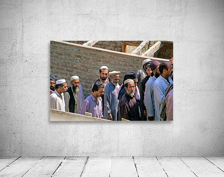 Men heading to work in Peshawar streets during morning hours Wall Preview