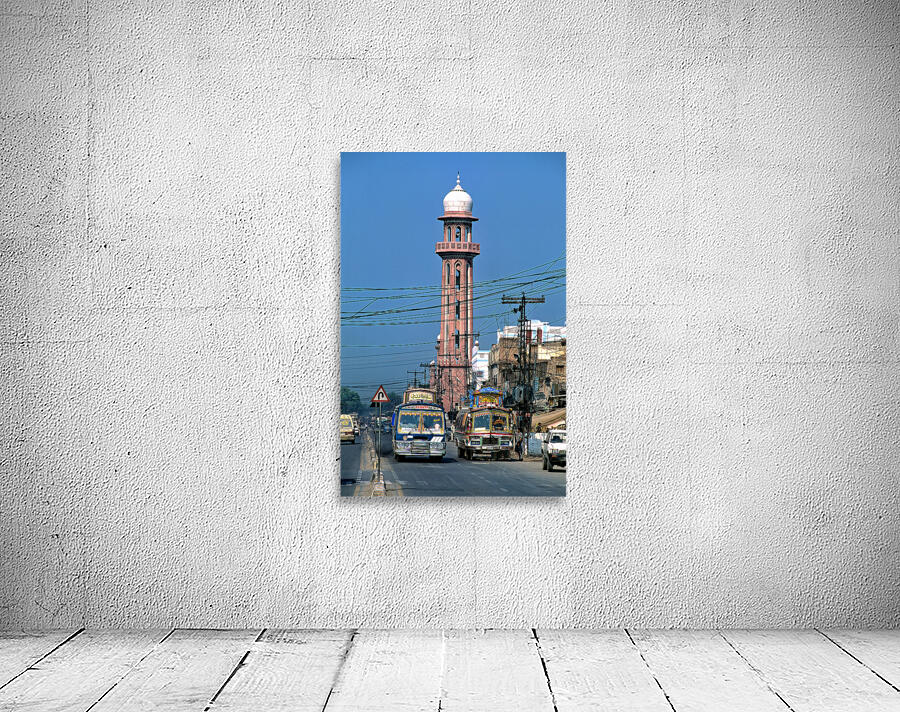 Busy street scene with tall tower in Peshawar Pakistan Wall Preview