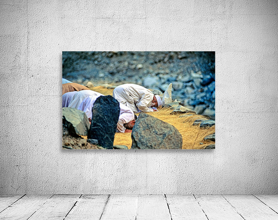 Muslim men pray towards Mecca in Pakistan during prayer time Wall Preview