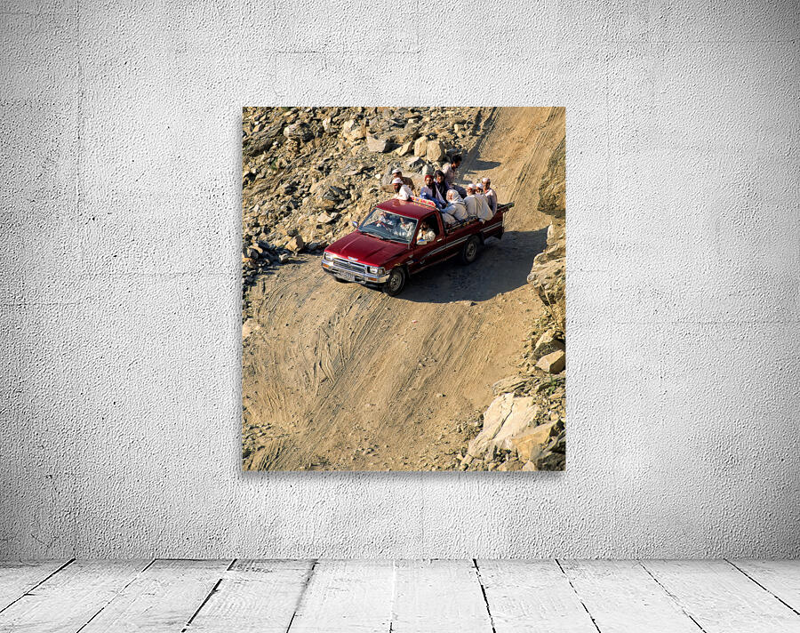 Travelers on gravel road near Shandur Pass in Pakistan Wall Preview