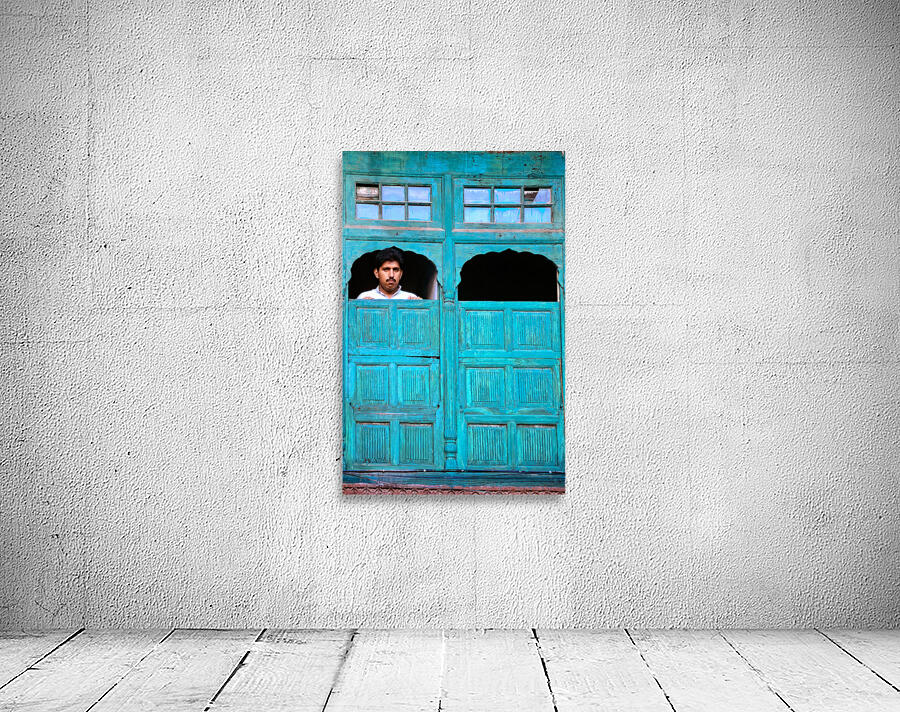 Man looks out from window in Lahore Pakistan Wall Preview