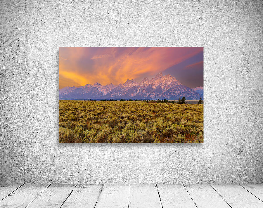 Hikers explore view of Grand Teton mountains at sunset Wall Preview