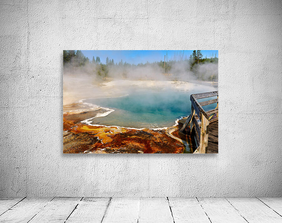 Steam rises from Abyss Pool as blue water reflects the surrounding landscape at Yellowstone National Park. Visitors explore the area nearby. Wall Preview