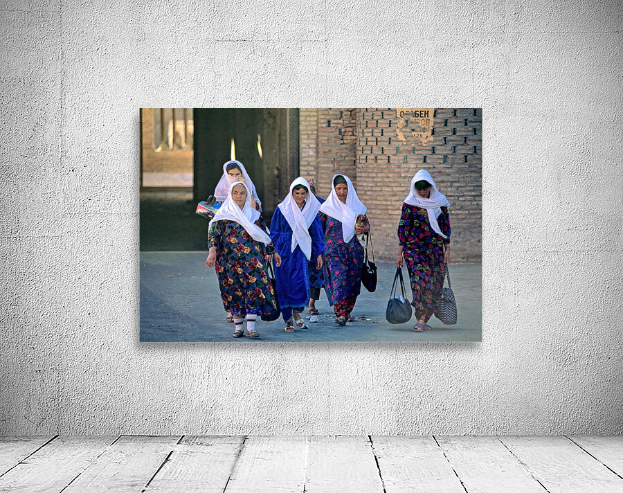 Women stroll through Khivas streets with tradition Wall Preview