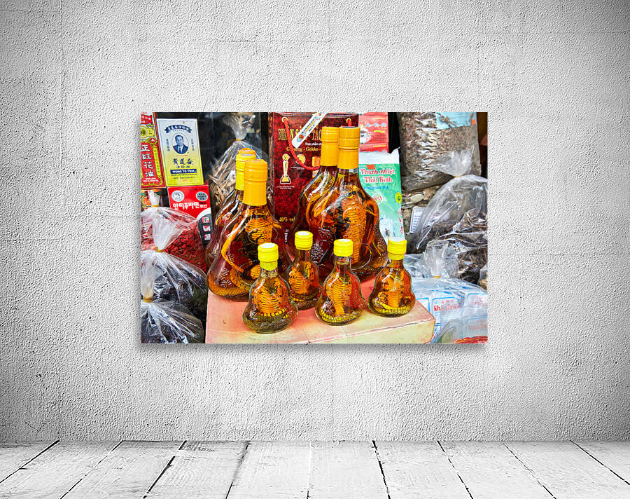 Vietnamese snake wine bottles displayed in Hanoi market Wall Preview