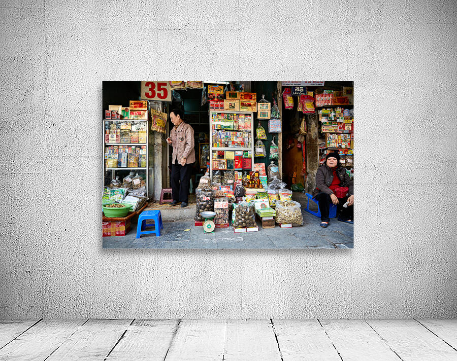 Market scene with vendors selling goods in Hanoi Wall Preview