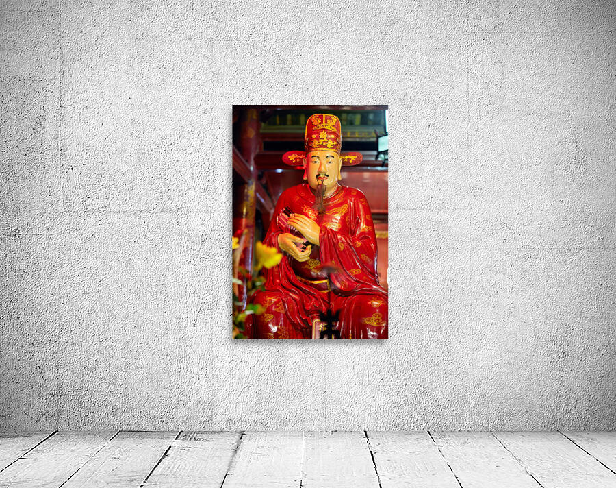 Statue of a deity in Hanoi Vietnam showing traditional clothing Wall Preview