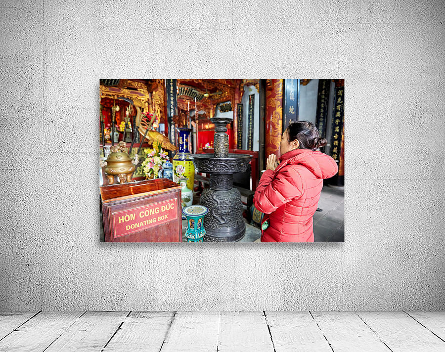Praying at a temple in Ho Chi Minh City Vietnam Wall Preview