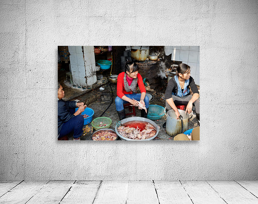 Women preparing fish in a market in Hanoi Vietnam Wall Preview