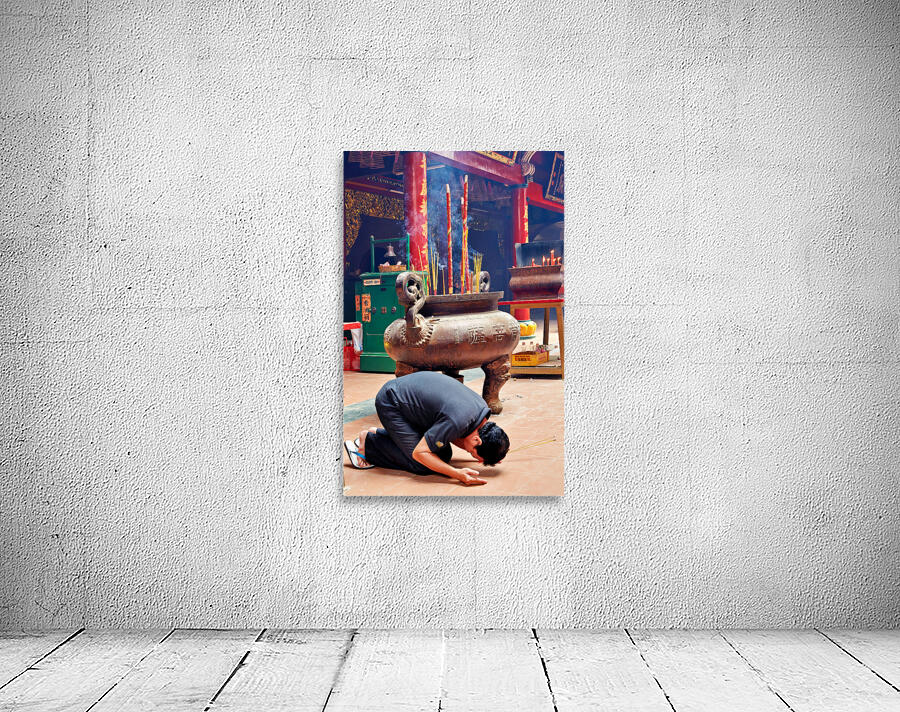 Man praying at a shrine in Ho Chi Minh City Vietnam Wall Preview