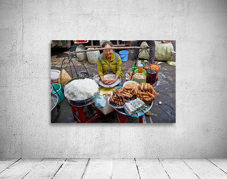 Woman selling food at street market in Ho Chi Minh City Wall Preview