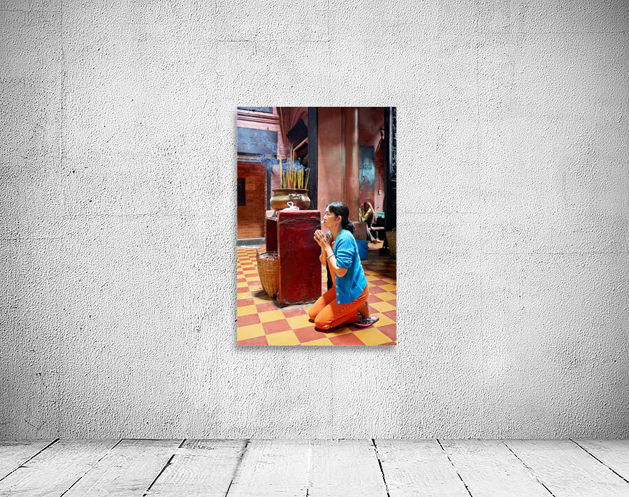 Woman prays at a temple in Ho Chi Minh City Vietnam Wall Preview