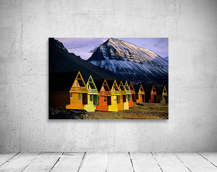 Colorful cabins in Longyearbyen Svalbard near snowy mountains Wall Preview