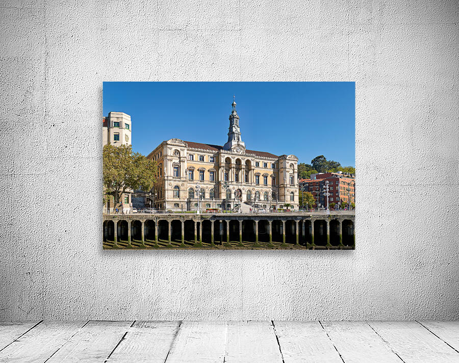 Building stands in Bilbao Spain next to water and trees Wall Preview