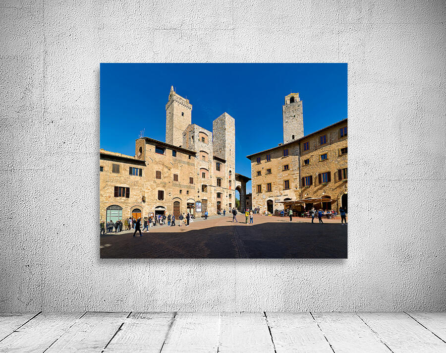 Visitors explore Piazza della Cisterna in San Gimignano Wall Preview