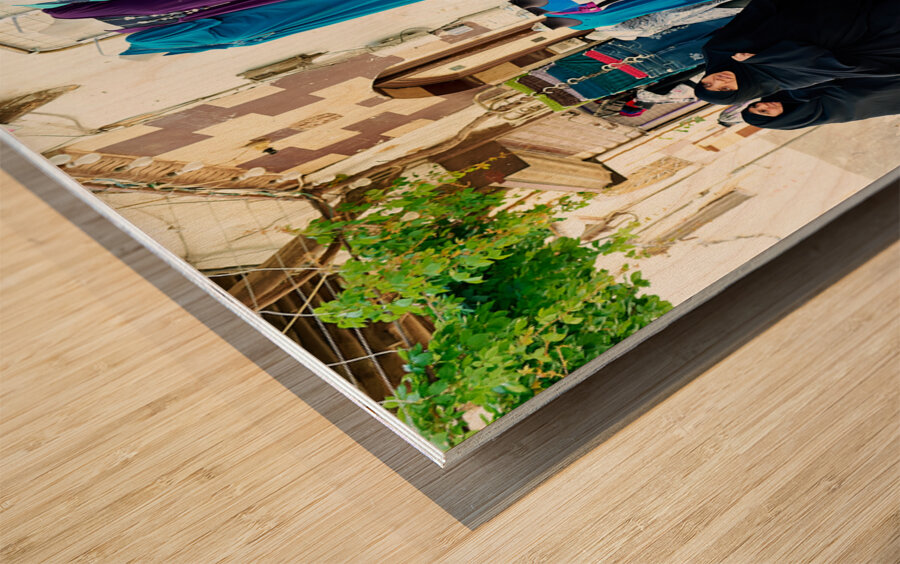 Syria. Damascus. Veiled women looking at western dresses Wood print