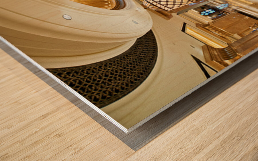 Opulent hotel lobby with grand staircase and golden chandeliers. Wood print