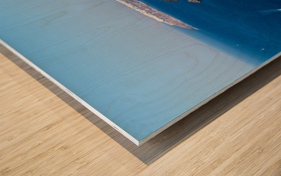 Santorini caldera with cliffs deep blue sea port and distant  Wood print