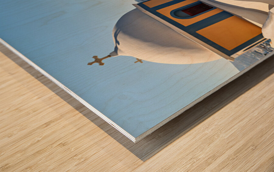 Santorinis iconic church and caldera with ships. Wood print