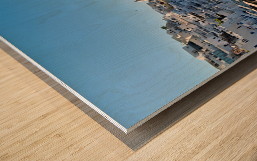 Santorinis white village blue caldera and cruise ships. Wood print