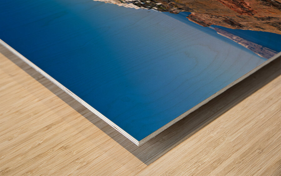 Santorini: White cliffside village blue sea clear sky. Wood print