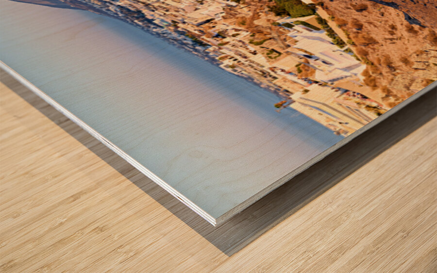 Santorinis Fira town on caldera cliff at sunset. Wood print