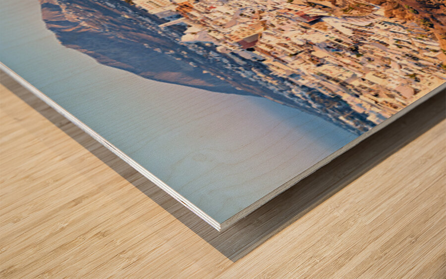 Picturesque Santorini cliffside town with winding path and vibra Wood print