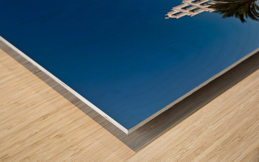 White Greek church with blue dome bell tower and marble courty Wood print