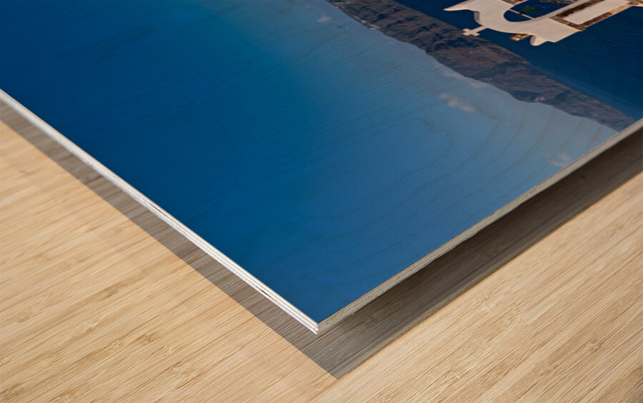 Santorinis iconic white churches blue domes and caldera view. Wood print