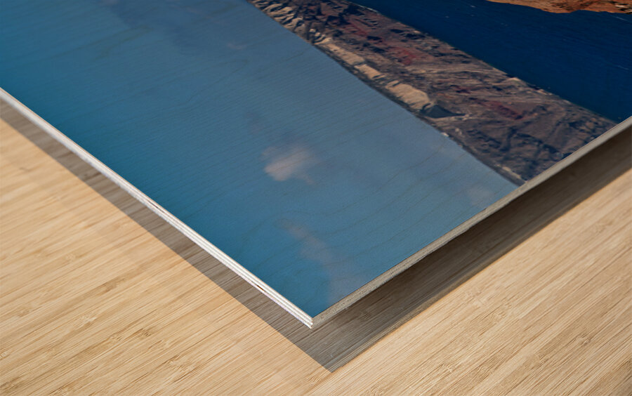 Santorinis iconic white buildings and blue domes overlooking th Wood print