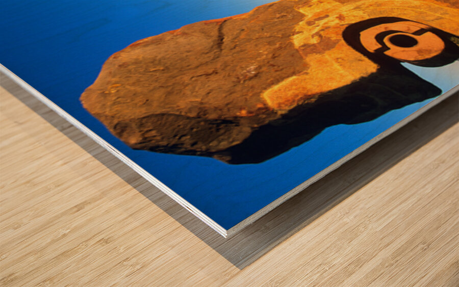 Sandstone sculptures glow at sunset in the Australian outback. Wood print