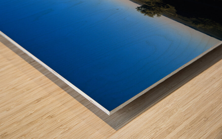 Carved stone monument in the Australian outback at sunset. Wood print