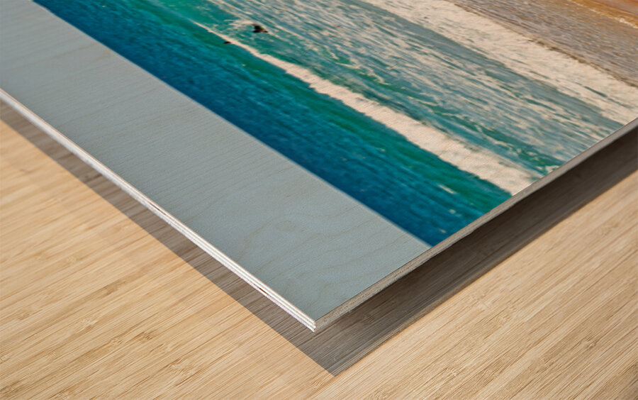 Surfer girl with surfboard on beach watching waves Wood print