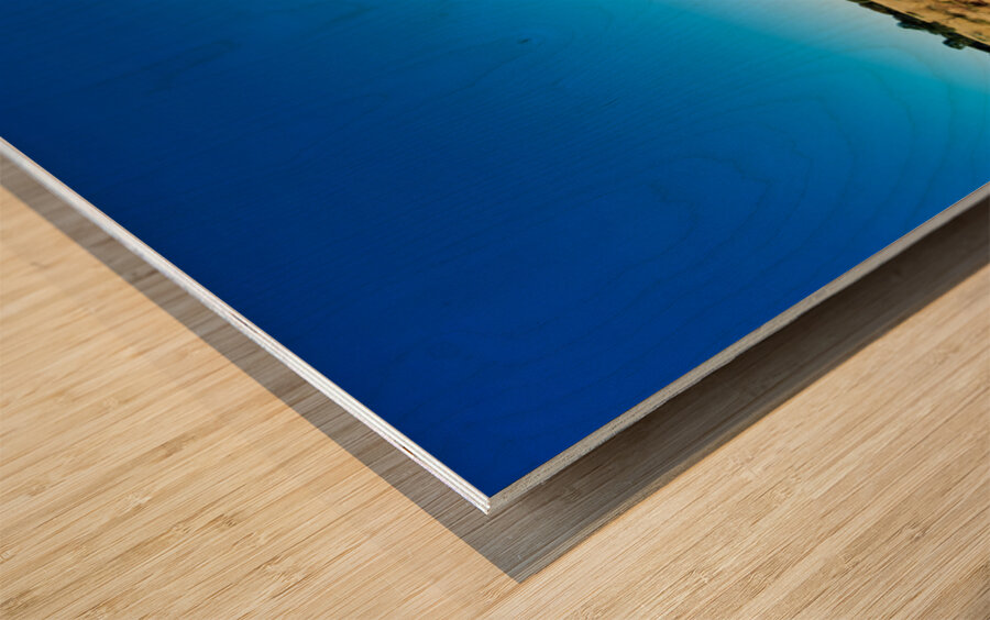 Uluru Australias iconic sandstone monolith under a clear blue Wood print