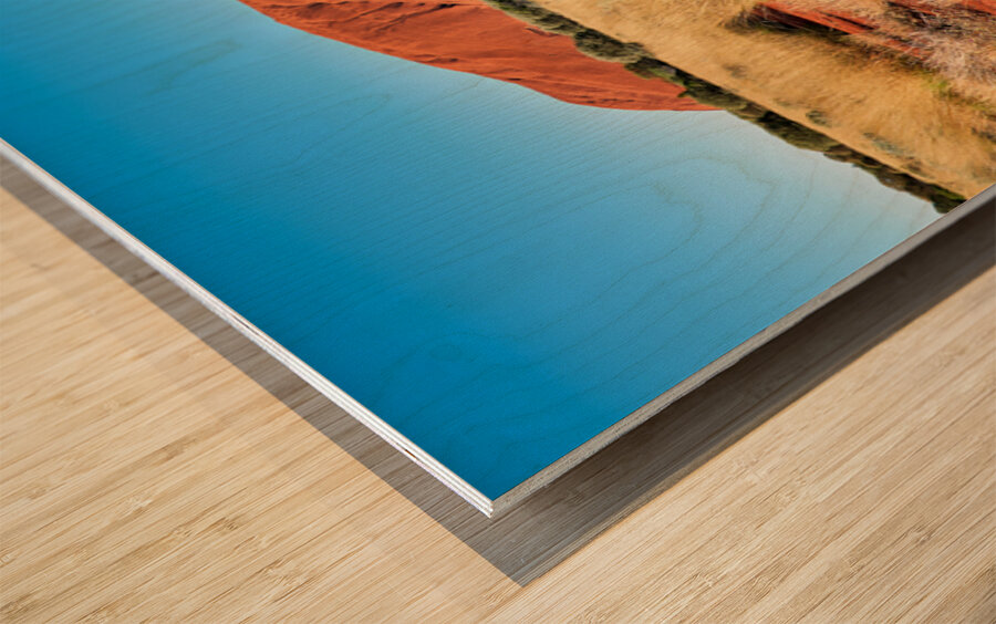 Uluru Australias iconic sandstone monolith under a clear blue Wood print