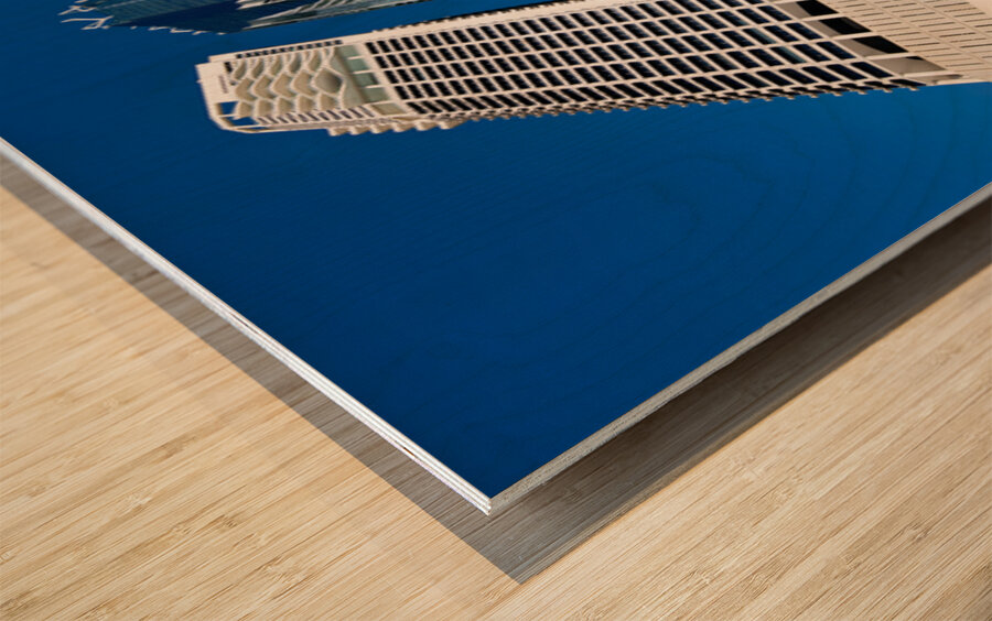 Woman walks on stairs in modern urban area with tall buildings Wood print