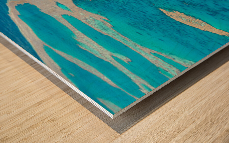 Aerial view of coral reefs and boats in turquoise ocean. Wood print