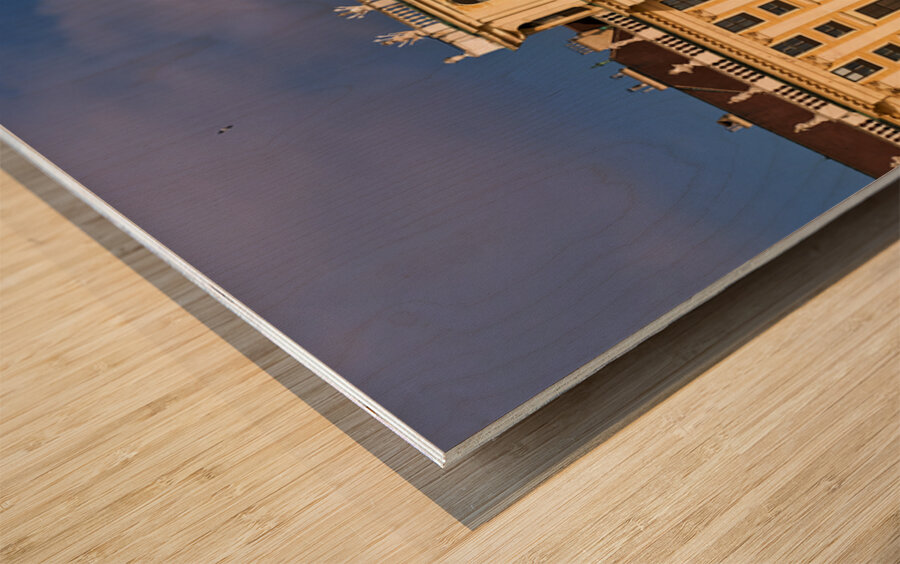 Ornate yellow palace facade with people and blue sky. Wood print