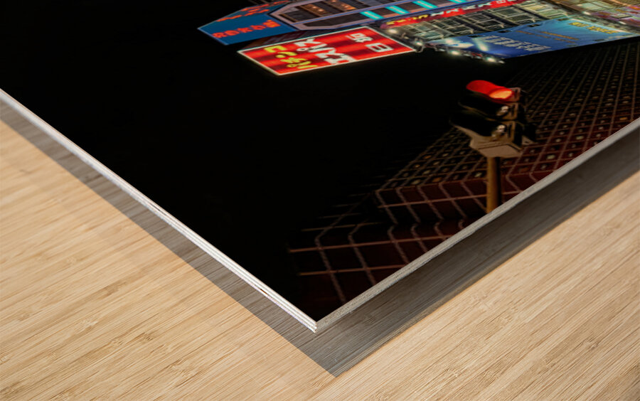 Neon lights shine bright in Shinjuku district of Tokyo at night Wood print