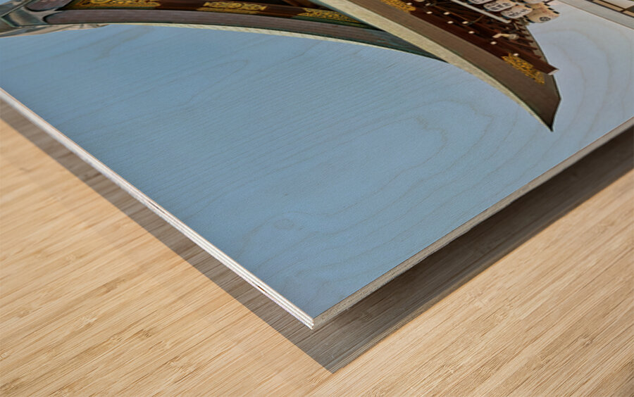 Visitors admire Yasaka shrine in Kyoto during sunny day Wood print