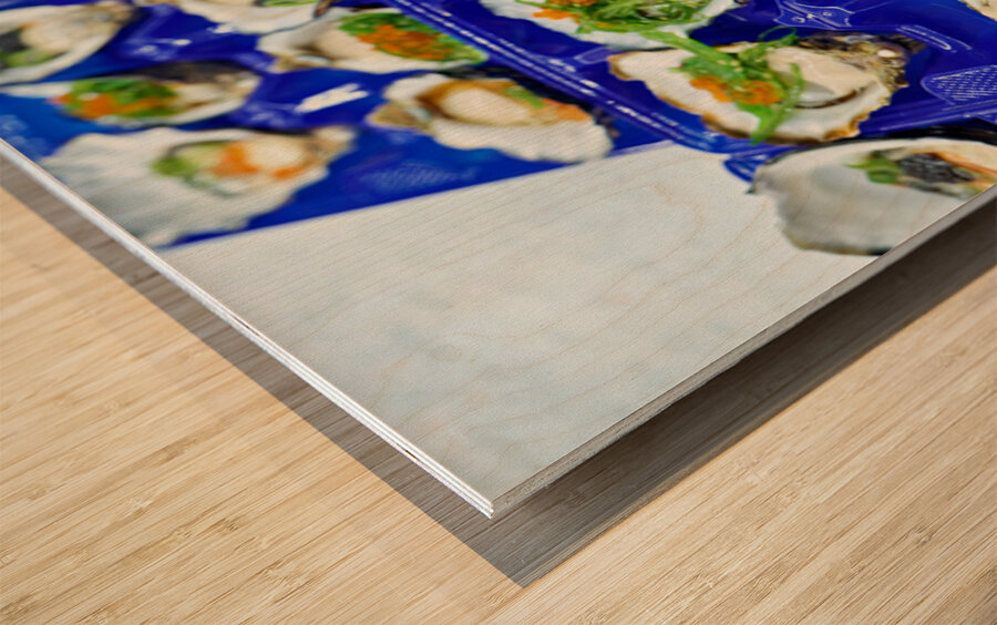 Fresh oysters with garnishes in blue trays. Wood print