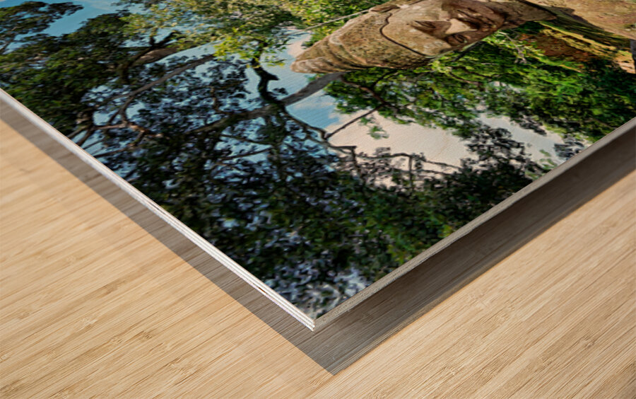 Ancient stone statues line path to Angkor Thom gate. Wood print