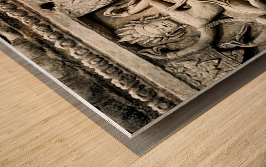 Ancient stone carvings of dancing Apsaras on a temple wall. Wood print