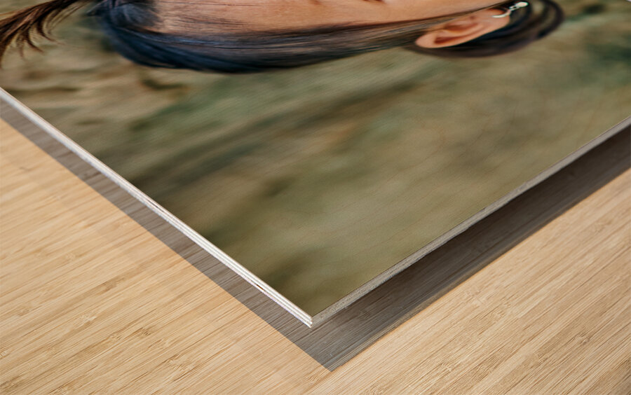 Joyful young girl with a playful smile and tongue out. Wood print