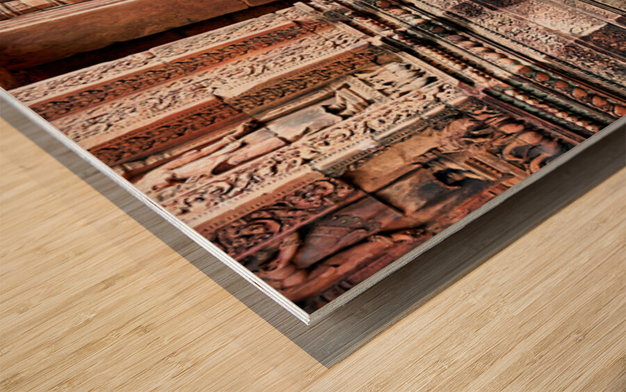 Ancient Cambodian temple with intricate carvings and guardian st Wood print