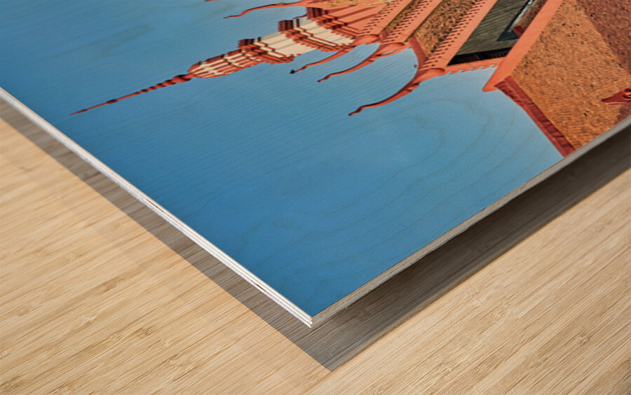 Monk walks through traditional Cambodian temple garden. Wood print